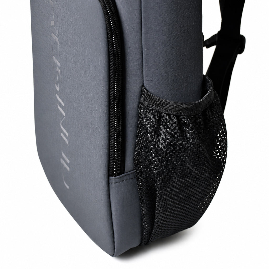 Stretch mesh bottle pocket on the side of the slate gray pickleball bag.