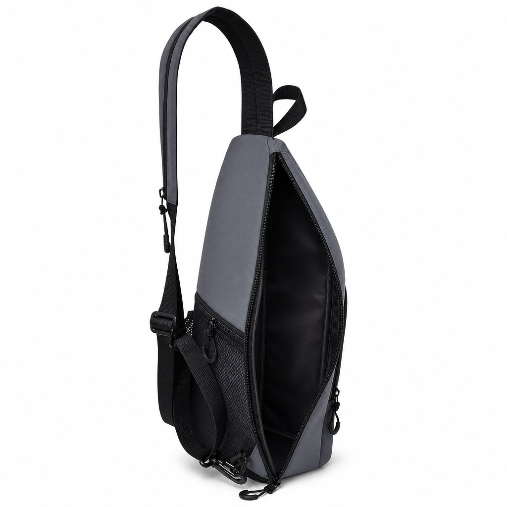 Side-opening main compartment of the slate gray pickleball sling backpack.