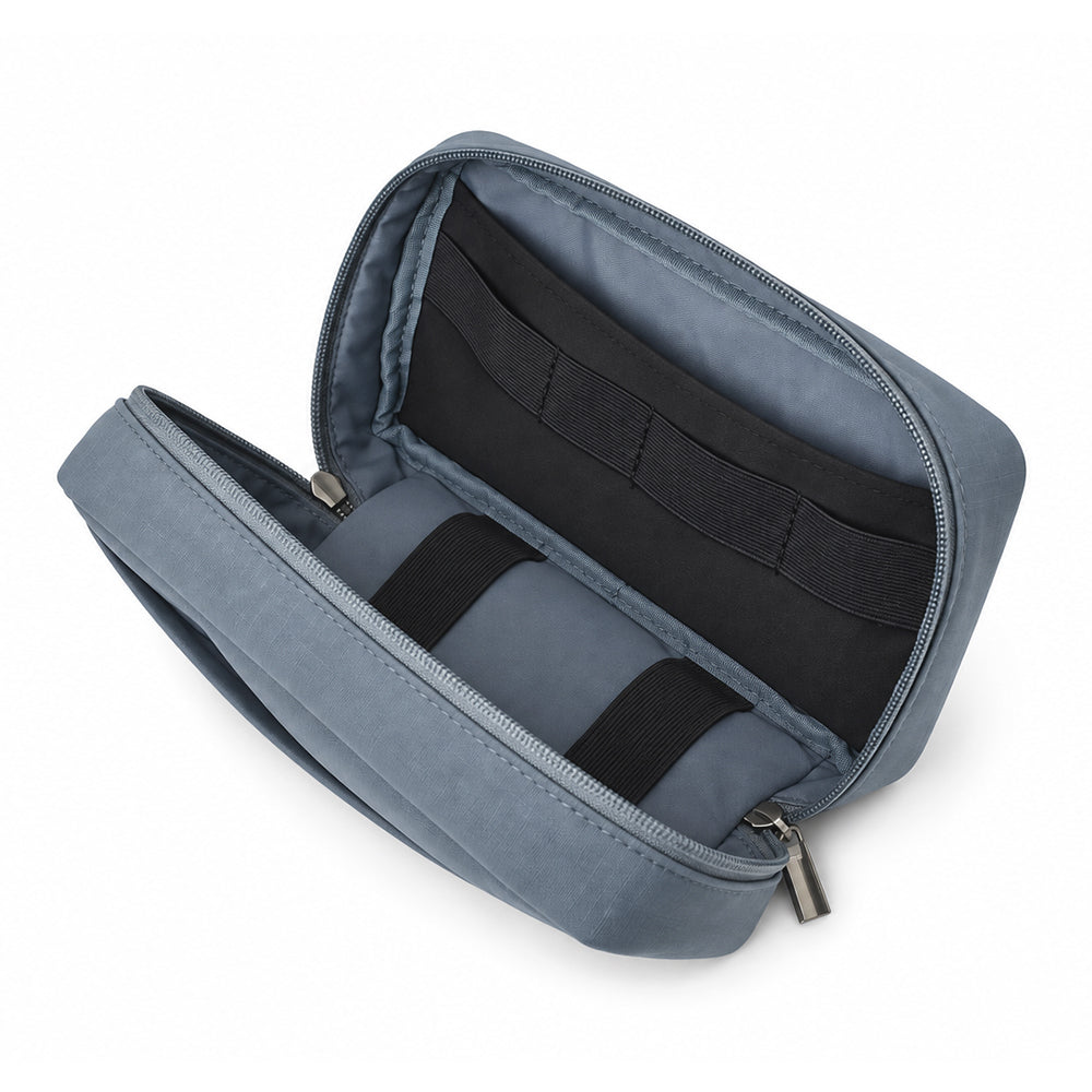 Open blue-gray tech organizer with an internal slip pocket and elastic organization loops.