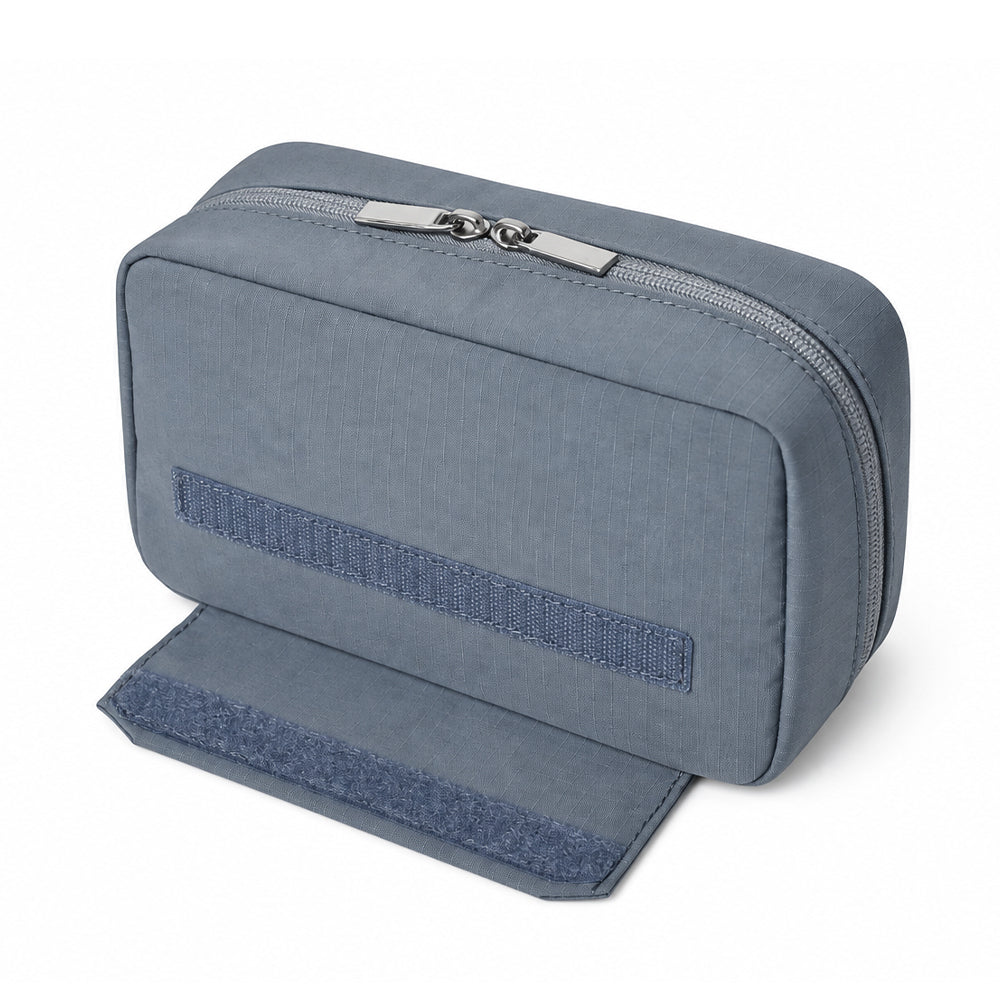 Fold-out support flap on the back of the tech organizer, showing the hook-and-loop closure.