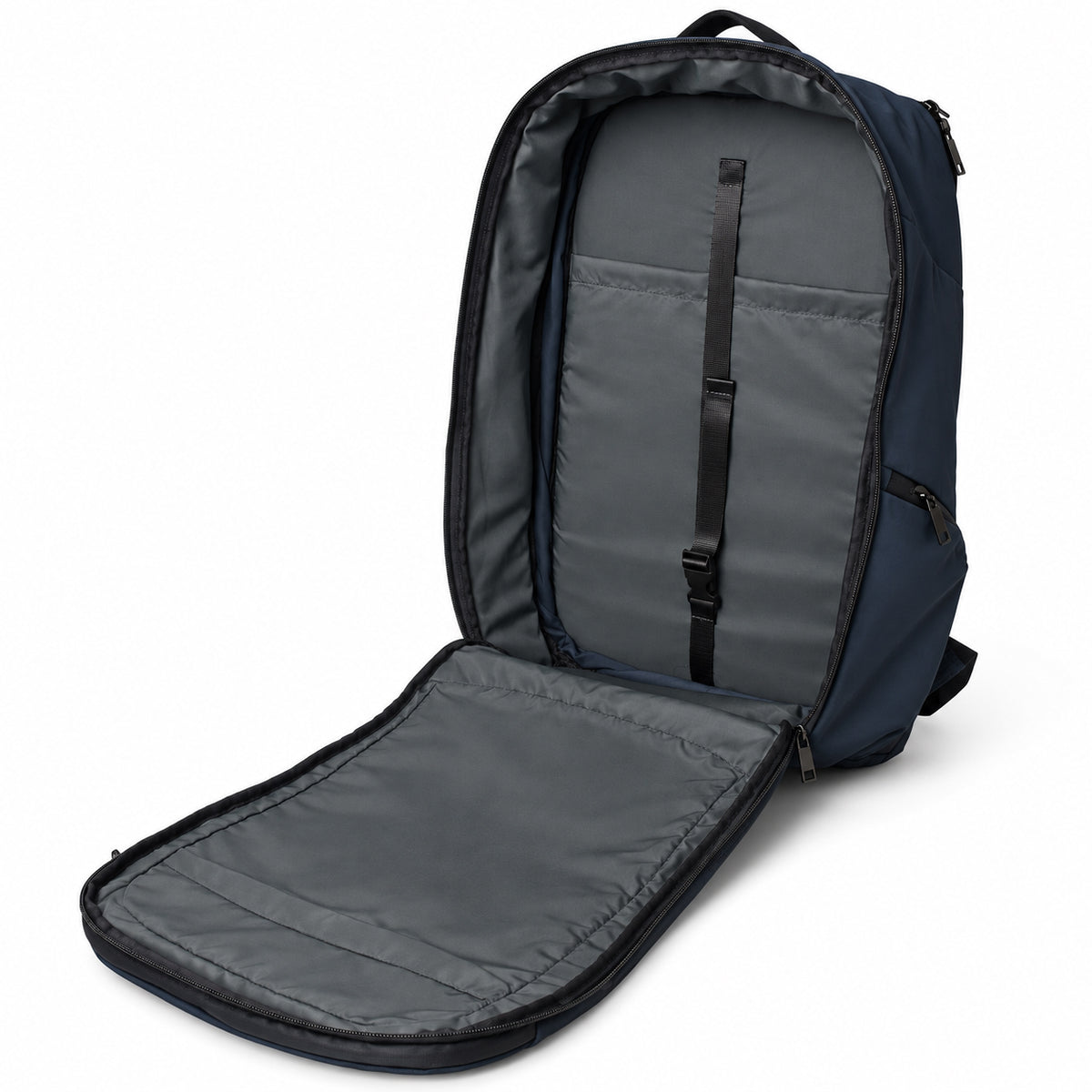 Open navy backpack showing the gray interior and internal sleeve with retaining strap.