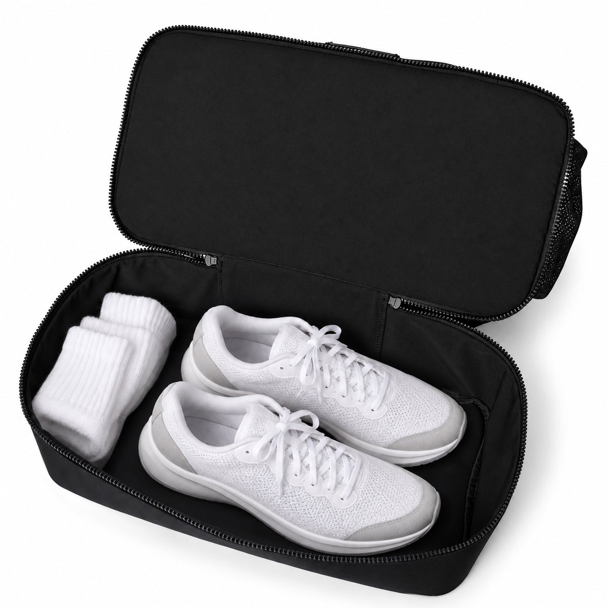 Open bottom compartment of the ROSINOP travel tote with shoes and socks used as props.
