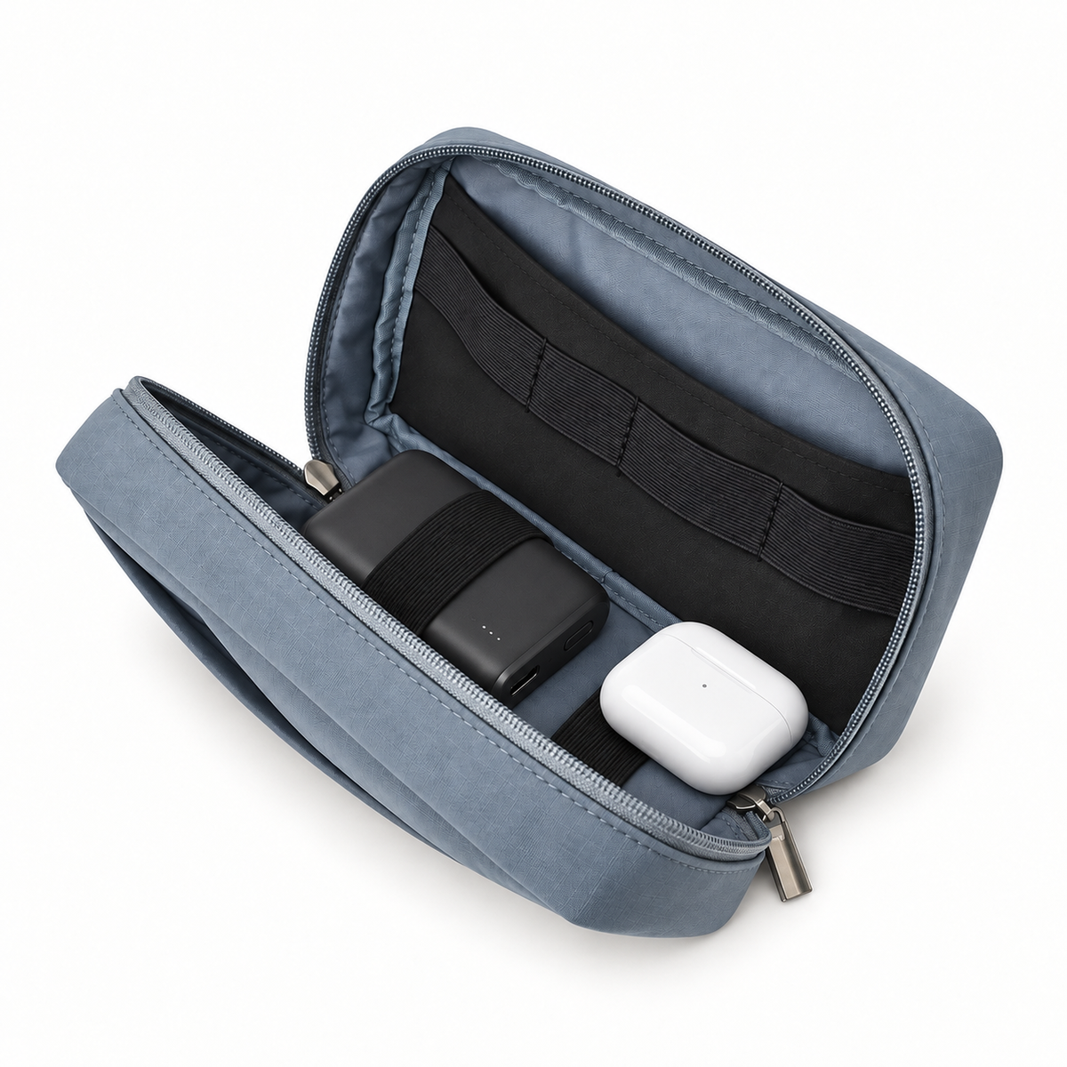 Open tech organizer holding a compact power bank and earbud case, showing internal elastic loops.